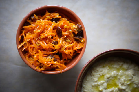 A bowl of carrot and walnut salad