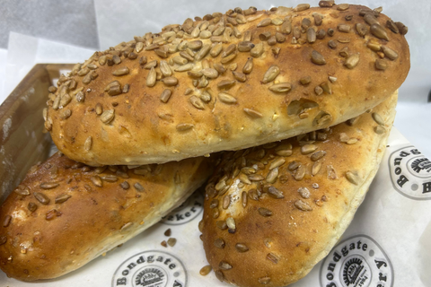 Three freshly baked sunflower oval loaves